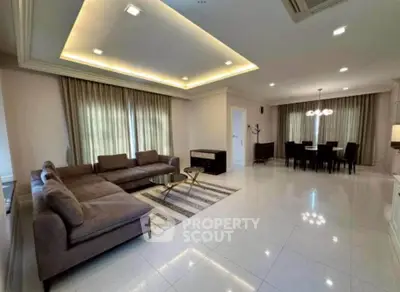 Spacious modern living room with elegant dining area and stylish lighting