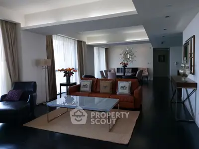 Elegant living room with modern furniture and stylish decor, featuring a spacious open layout and natural light.