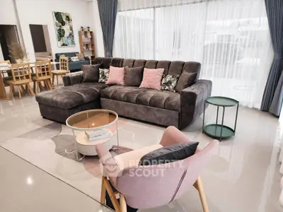 Spacious modern living room with plush gray sofa and elegant decor