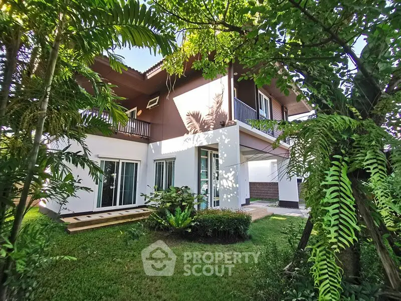 Stunning two-story house with lush garden and spacious balcony, perfect for serene living.