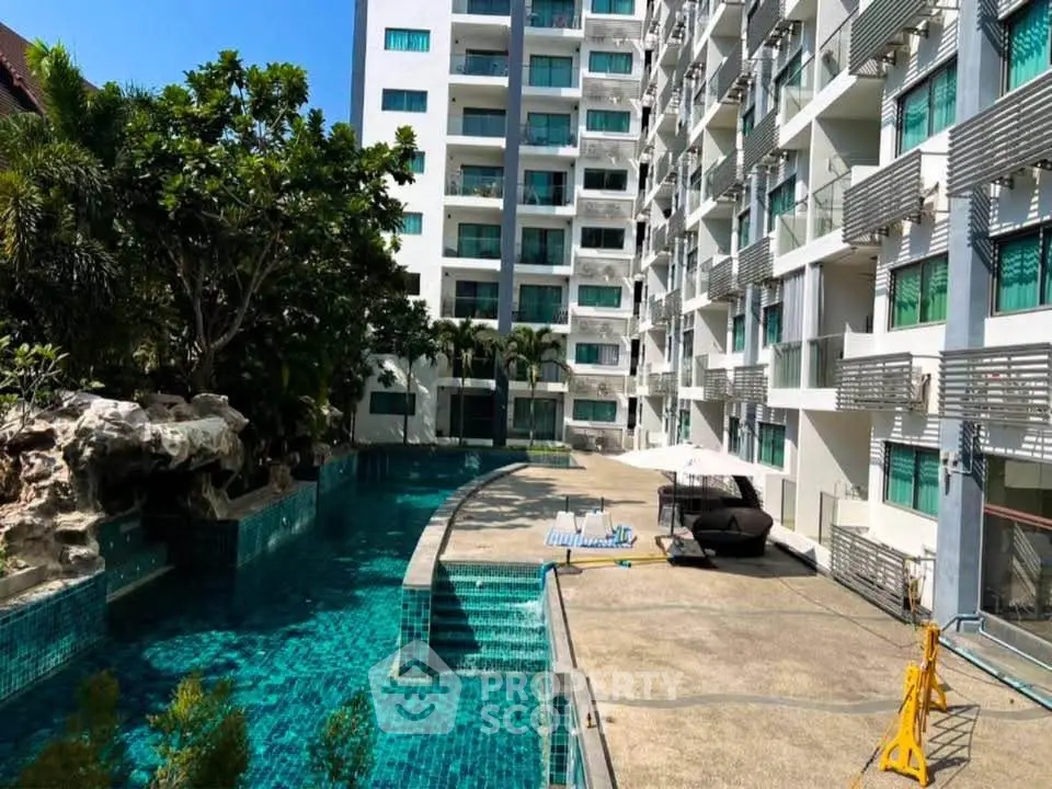 Luxurious condominium with stunning pool and modern architecture