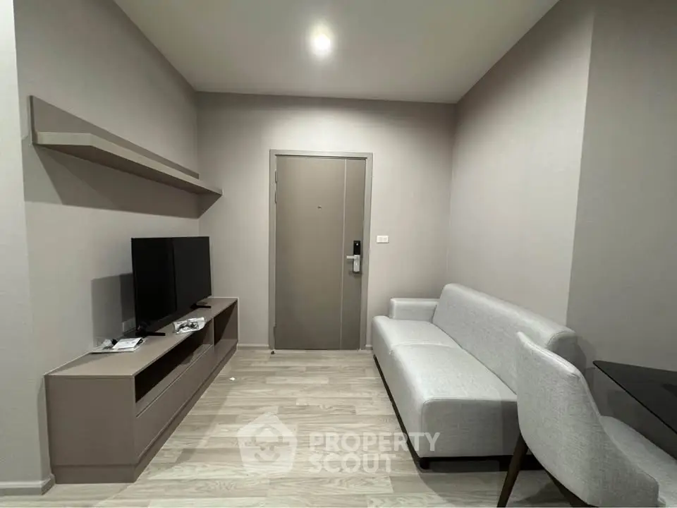 Modern living room with sleek furniture and neutral tones