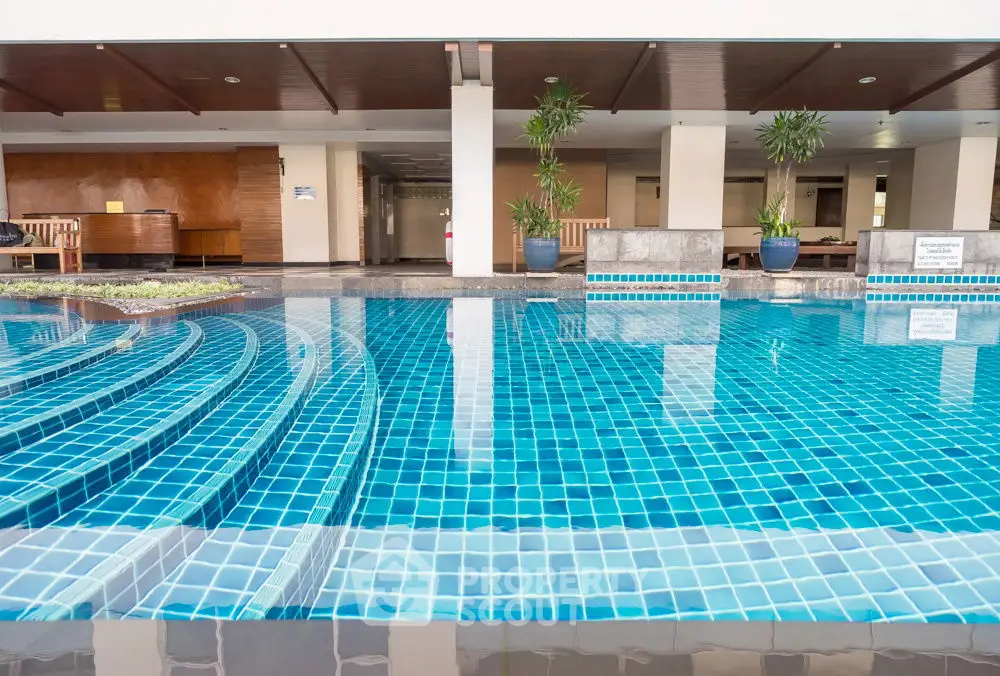 Luxurious swimming pool area with modern design and serene ambiance.