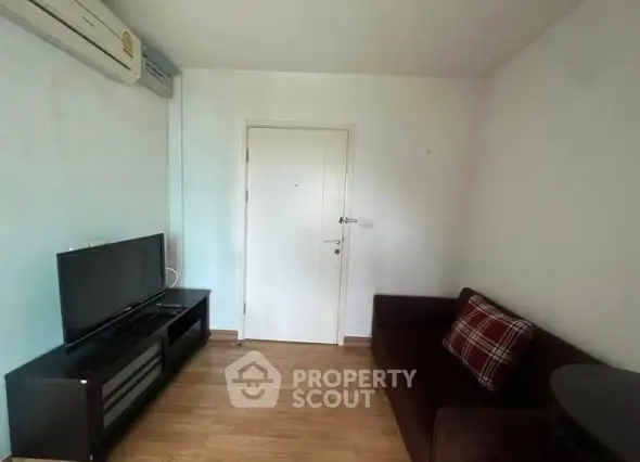 Cozy living room with modern TV setup and comfortable sofa