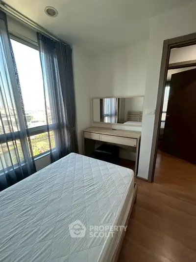 Cozy bedroom with natural light and modern furnishings