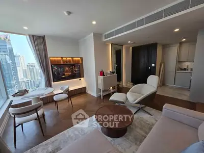 Luxurious modern living room with city view, elegant furniture, and open kitchen layout.