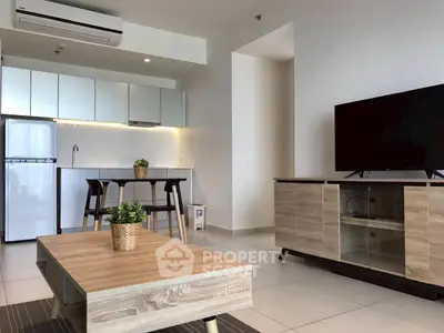 Modern open-plan living room with sleek kitchen and stylish furniture