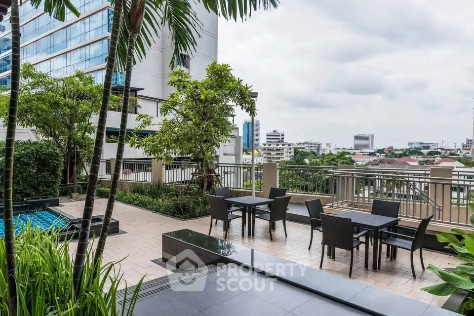 Stunning rooftop terrace with city views and modern outdoor seating area.