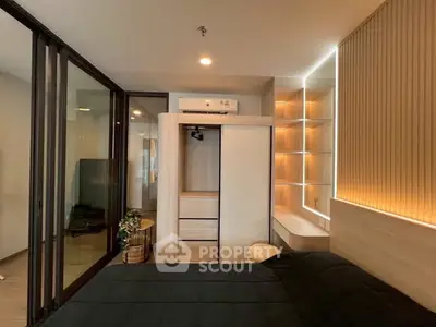 Modern bedroom with sleek design, built-in wardrobe, and ambient lighting for a cozy atmosphere.