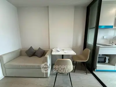 Modern compact living room with cozy sofa and dining area