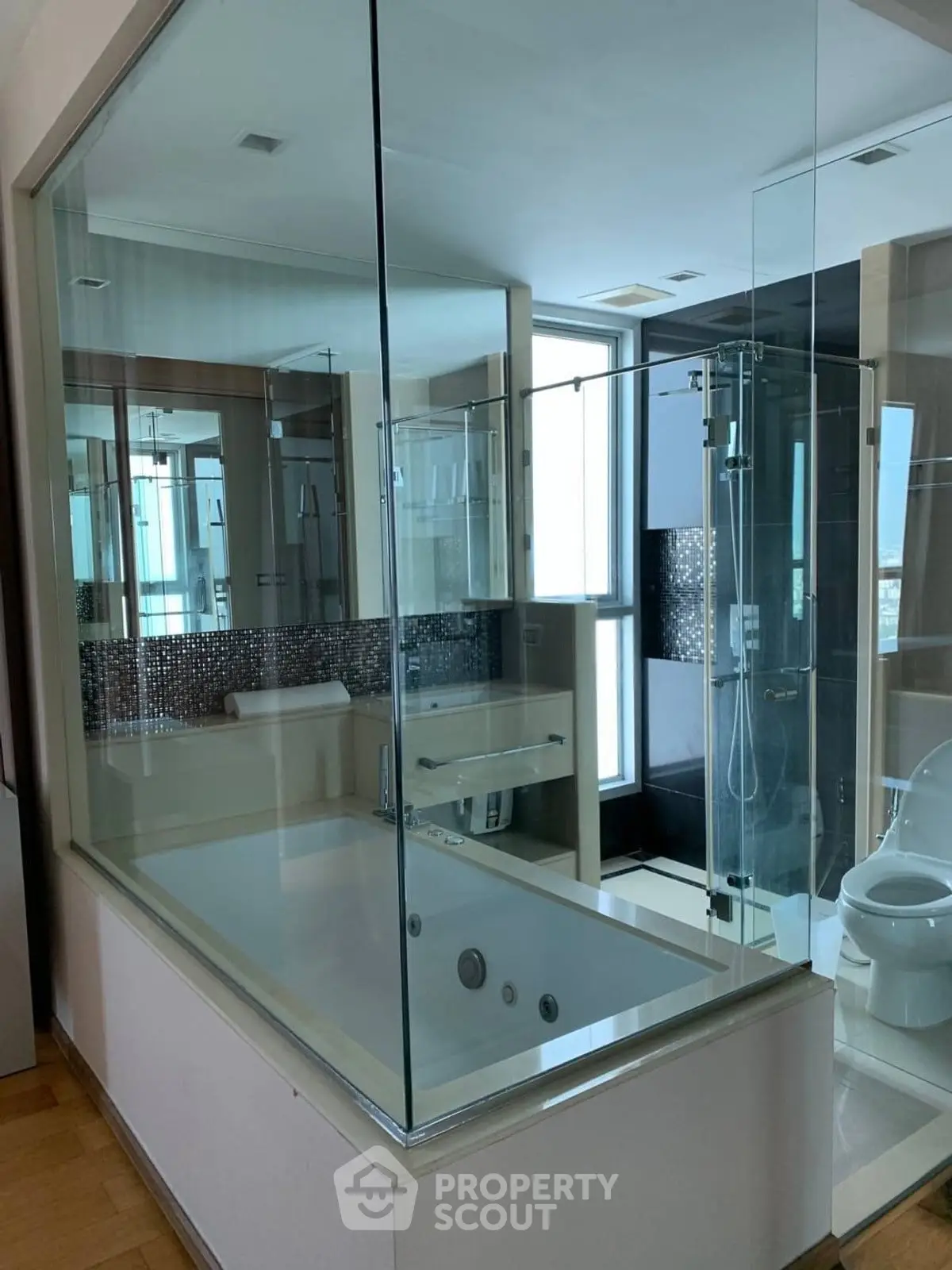 Luxurious modern bathroom with glass-enclosed shower and built-in bathtub