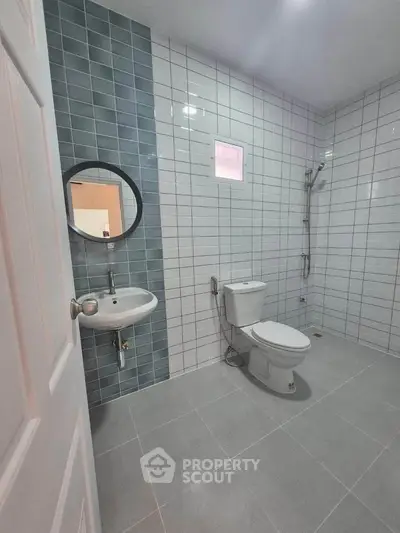 Modern bathroom with sleek tiles and minimalist fixtures
