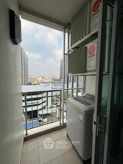 High-rise balcony with city view and washing machine, perfect for urban living.