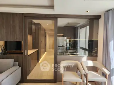 Modern open-layout kitchen with sleek design and cozy seating area