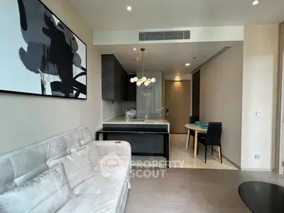 Modern living room with stylish decor and open kitchen layout