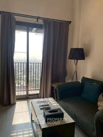 Cozy living room with balcony view and modern decor in urban apartment.