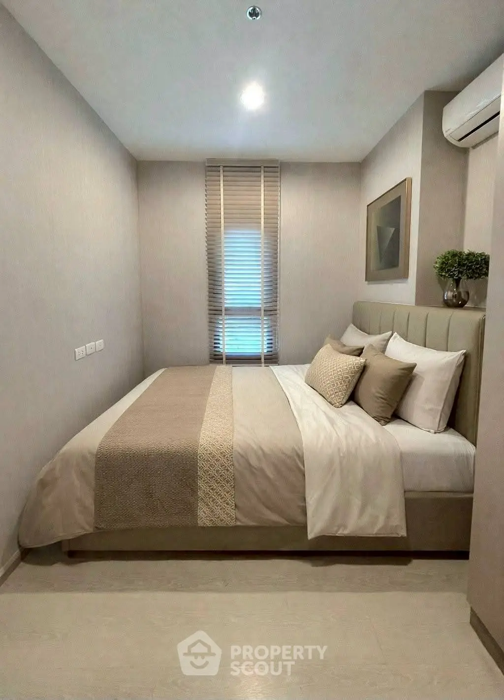 Cozy modern bedroom with stylish decor and natural light