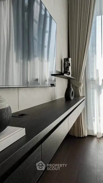 Modern living room with sleek TV setup and elegant decor