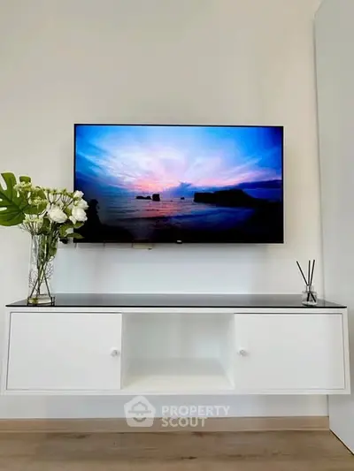 Modern living room with wall-mounted TV and elegant decor