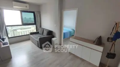 Modern apartment living room with city view and cozy bedroom