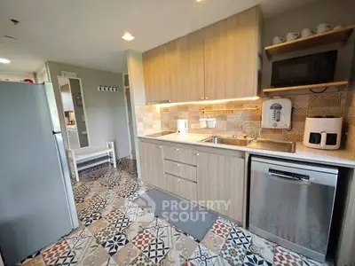 Modern kitchen with stylish tile flooring and sleek cabinetry