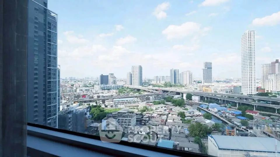 Stunning cityscape view from high-rise apartment window, showcasing urban skyline and vibrant city life.