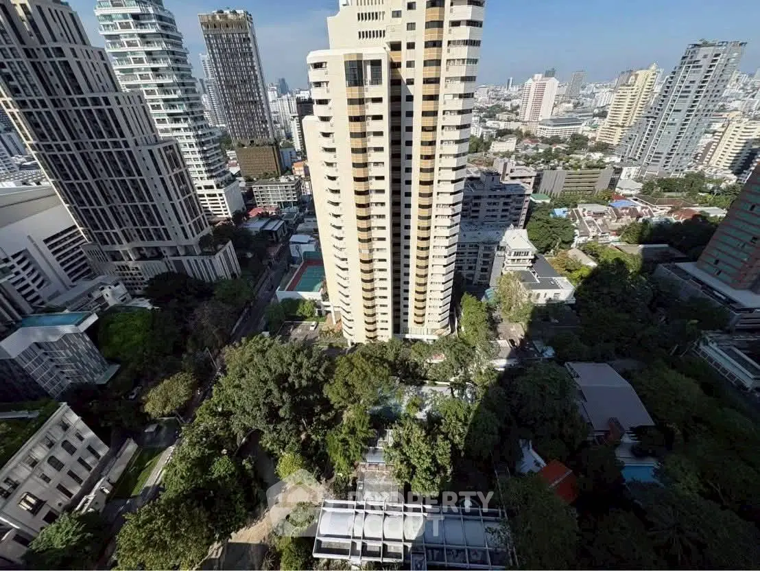 Stunning cityscape view with modern high-rise buildings and lush greenery in an urban setting.