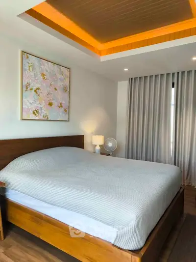 Modern bedroom with stylish ceiling lighting and elegant decor