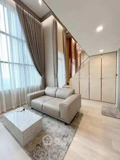 Luxurious modern living room with high ceilings and elegant decor