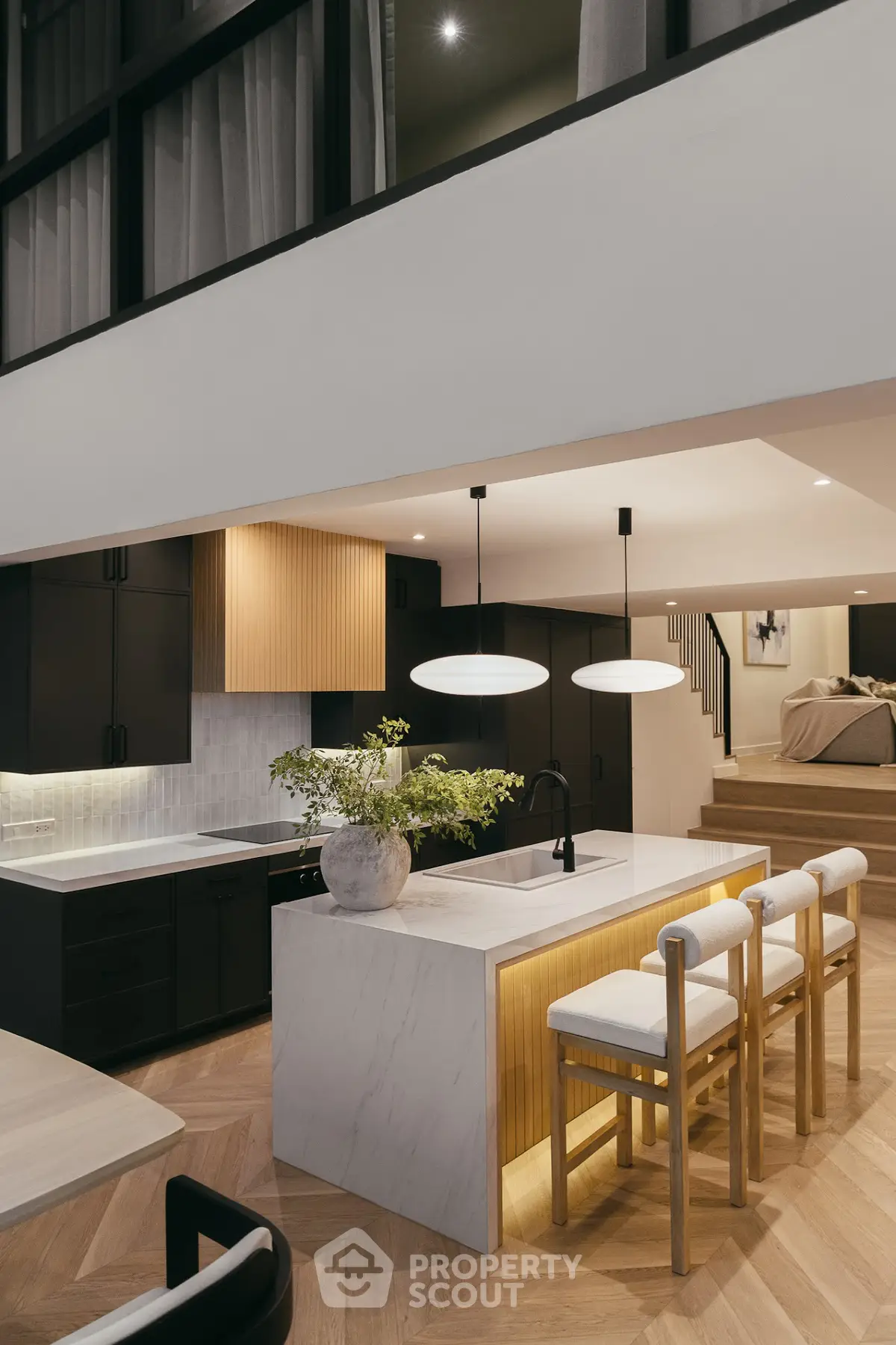 Modern kitchen with sleek design and elegant lighting