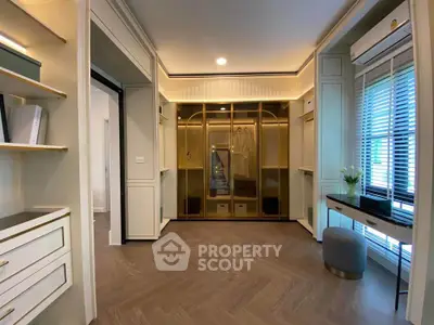 Luxurious walk-in closet with elegant cabinetry and ample storage space