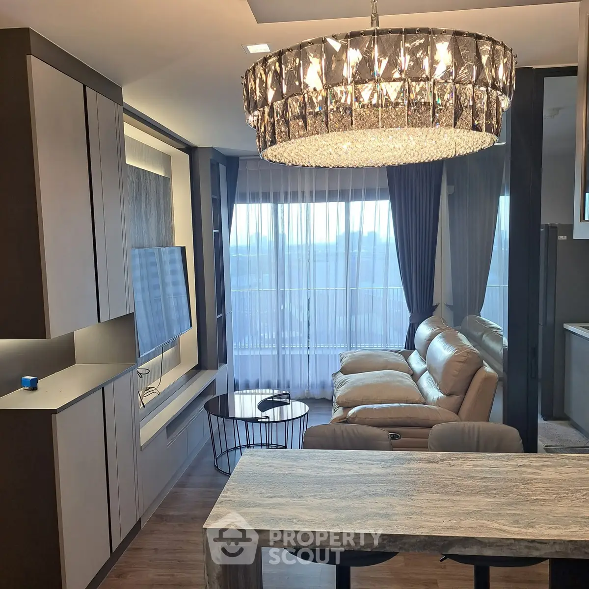 Luxurious living room with elegant chandelier and modern decor