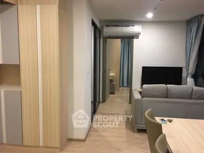 Modern living room with sleek furniture and air conditioning in a stylish apartment.