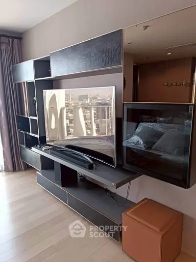 Modern living room with sleek entertainment center and city view