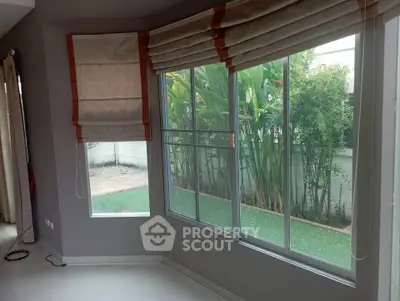 Bright corner unit with large windows overlooking lush garden, perfect for natural light lovers.