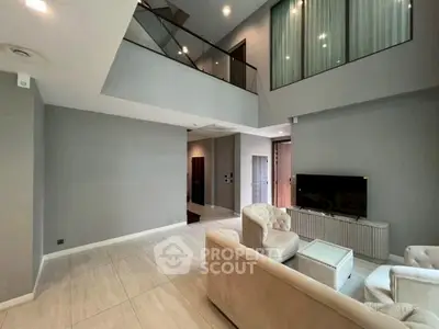 Spacious modern living room with high ceiling and elegant decor