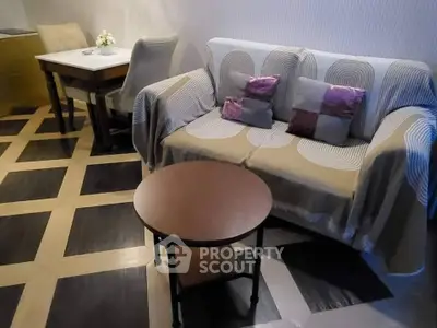 Cozy living room with stylish geometric flooring and modern furniture