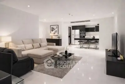 Spacious modern living room with open kitchen and elegant decor