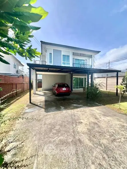 Modern two-story house with carport and spacious driveway