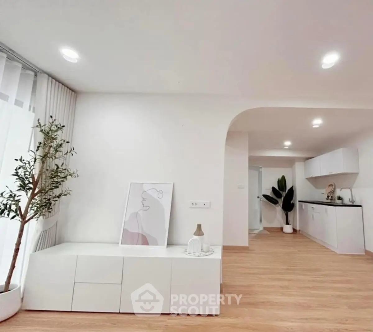 Modern minimalist living space with open kitchen and stylish decor