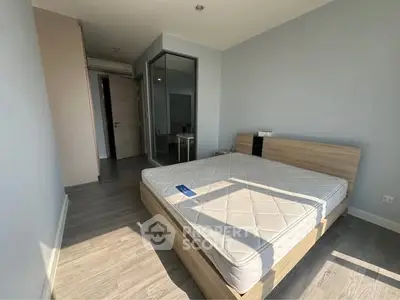 Spacious bedroom with modern design and ample natural light