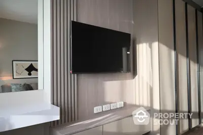 Modern living room with wall-mounted TV and stylish decor