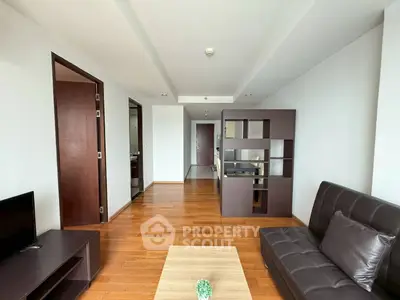 Spacious modern living room with wooden flooring and stylish furniture