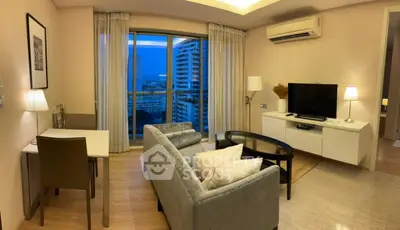 Modern living room with city view, stylish furniture, and cozy ambiance.