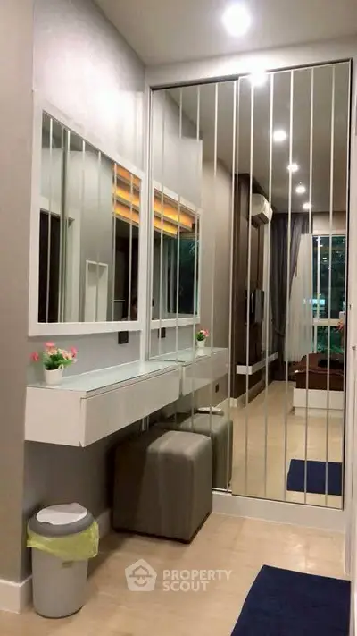 Modern hallway with mirrored closet and elegant decor