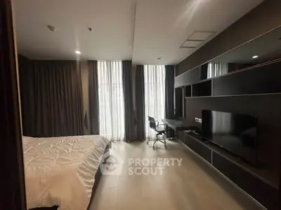 Modern bedroom with sleek design, large windows, and integrated workspace