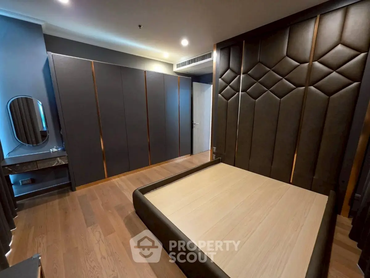 Luxurious modern bedroom with elegant design and spacious layout, featuring stylish furniture and ambient lighting.