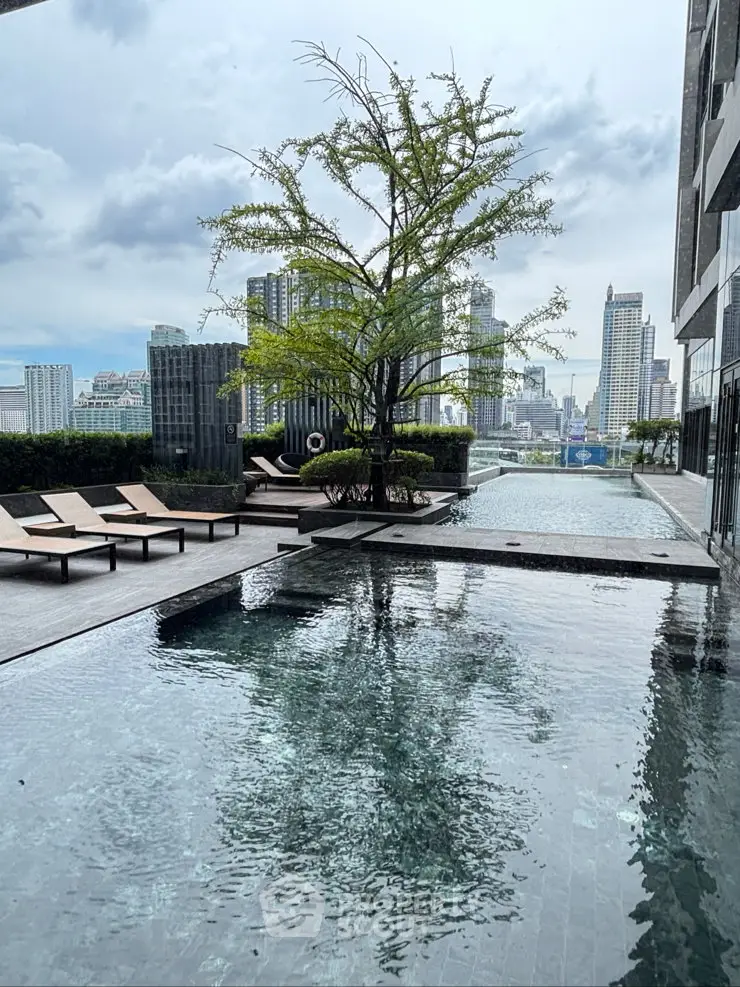 Luxurious rooftop pool with stunning city skyline views and modern lounge chairs.