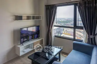 Modern living room with city view, sleek furniture, and large window for natural light.