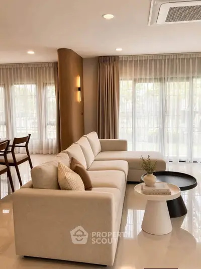 Spacious modern living room with elegant decor and natural light